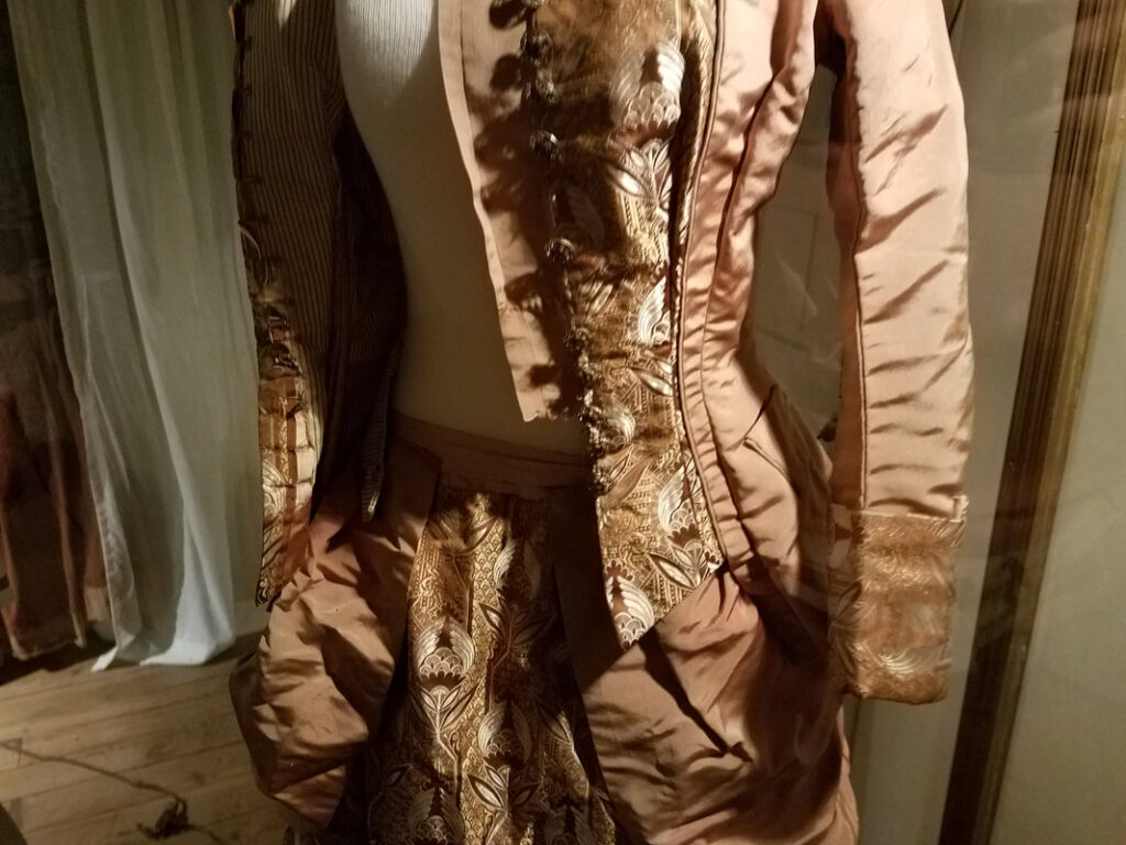Victorian gown bodice with brocade trim and decorative buttons at White Hall Kentucky