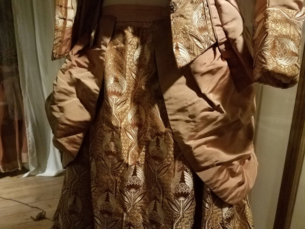 Victorian gown overskirt draping and brocade underskirt