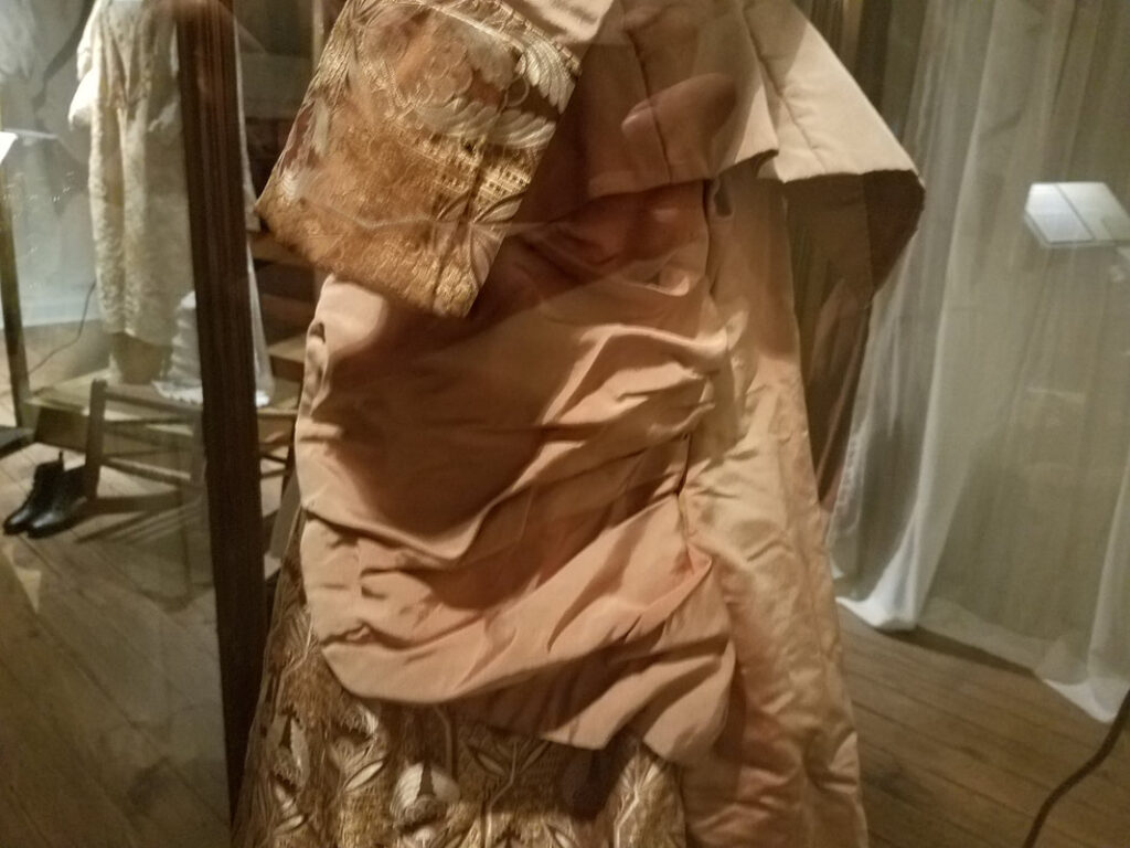 Side view of Victorian gown overskirt draping