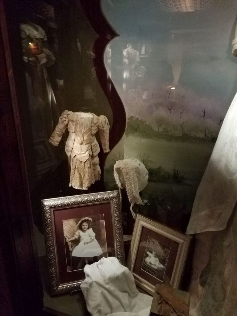 Historic Victorian children's clothing and lace bonnet at Boot Hill Museum