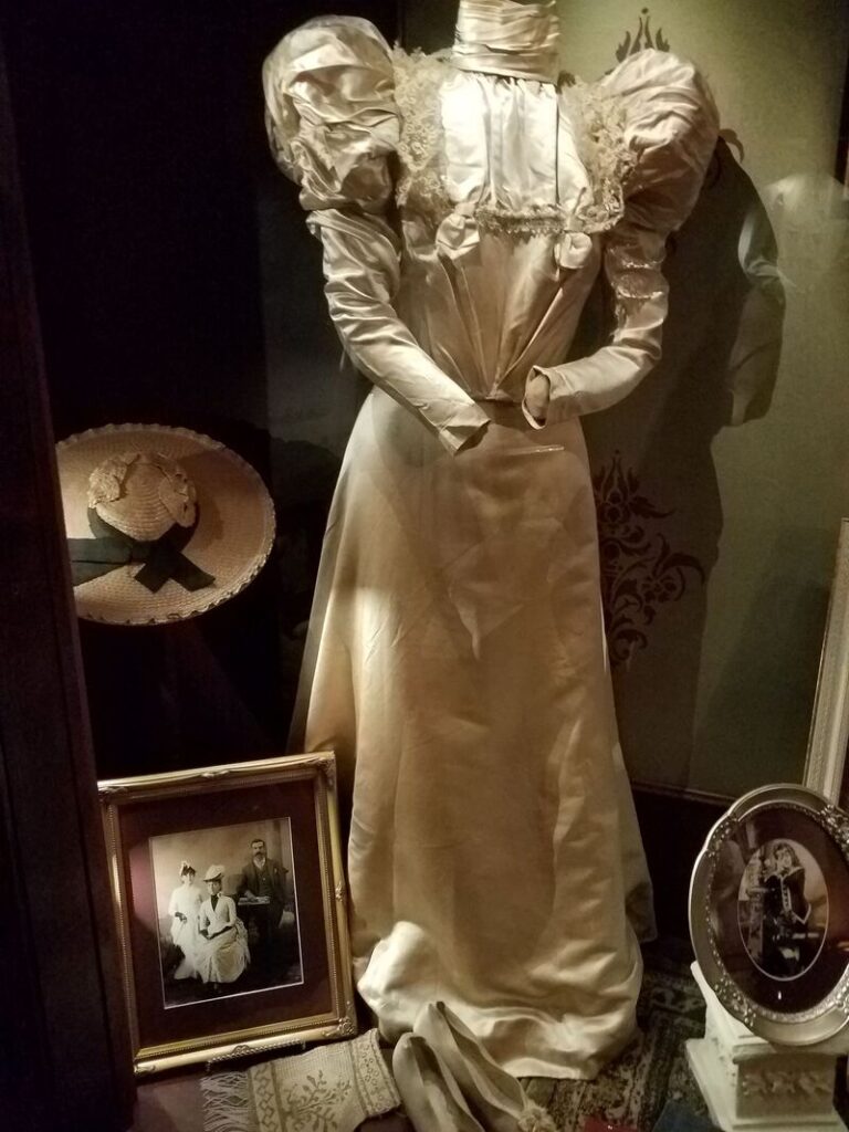 Historic late Victorian dress with dramatic puff sleeves and lace bodice at Boot Hill Museum